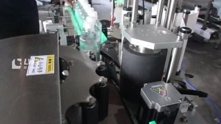 Mesin pelabelan botol bulat pemosisian roda bintang